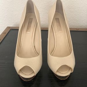 BCBG gold pumps